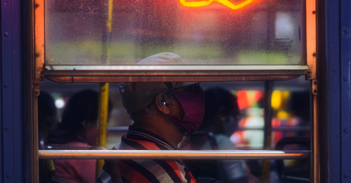 Map of bus stops for Greyhound in Canada? - A Profile View of A Man in a Bus Waring a Face Mask 