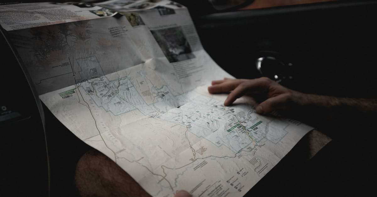 Map of highway fuel stops in Germany - Crop man with map in automobile