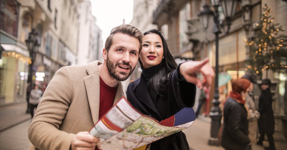 Maps with road drivability grading - Man in Brown Suit Standing Beside Woman Wearing Black Coat