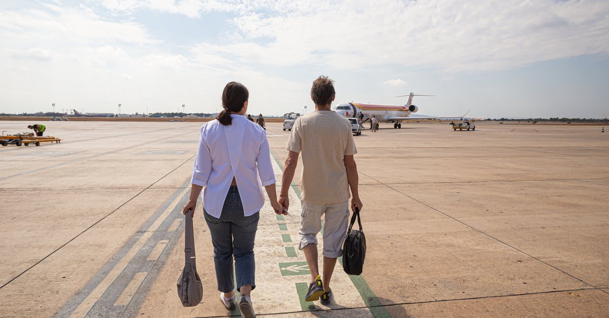 Marrakesh airport to Jemmaa el-Fna - Couple Walking in the Airport