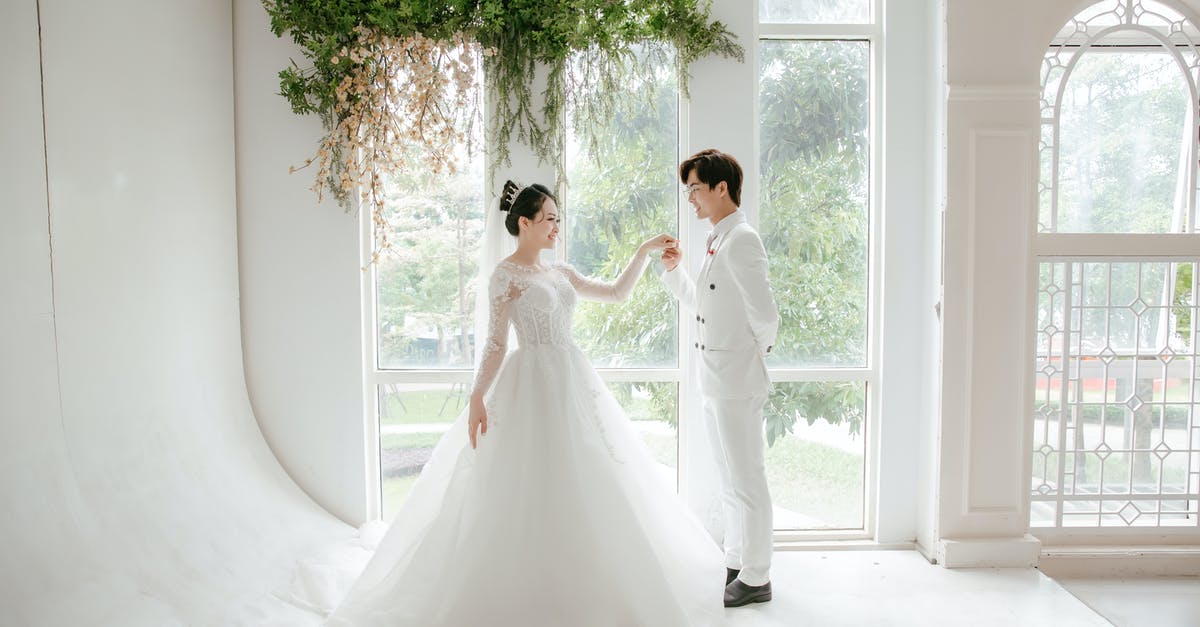 Marrying my Brazilian Fiance / Fiance visa [closed] - Positive ethnic newlywed couple standing near panoramic window