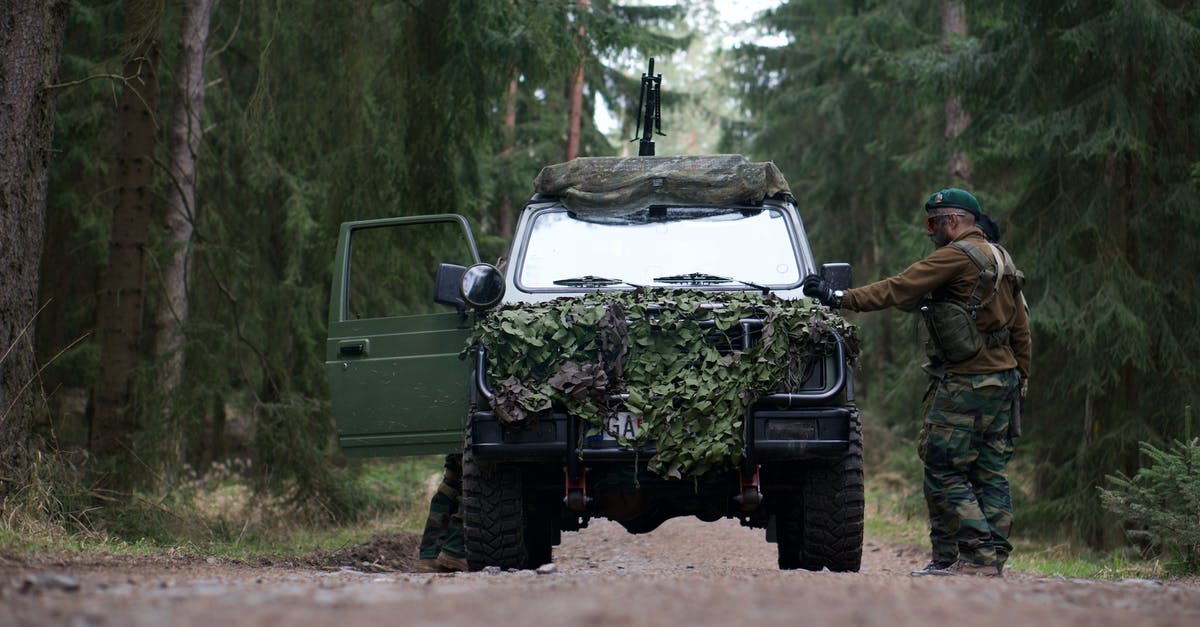 Maximizing Loyalty Programs - For a New Road Warrior - Army Official  Standing Beside Green Off road Car