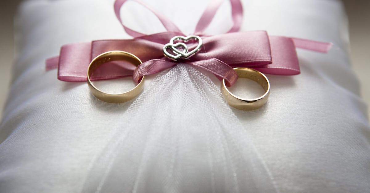 May I re-enter UK on a marriage visa that is about to expire? [closed] - Selective Focus Photography of Silver-colored Engagement Ring Set With Pink Bow Accent on Throw Pillow