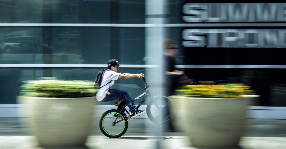 May kids ride in the back of a 5th Wheel in the US? - Man Riding Bicycle in City May kids ride in the back of a 5th Wheel in the US? - Man Riding Bicycle in City