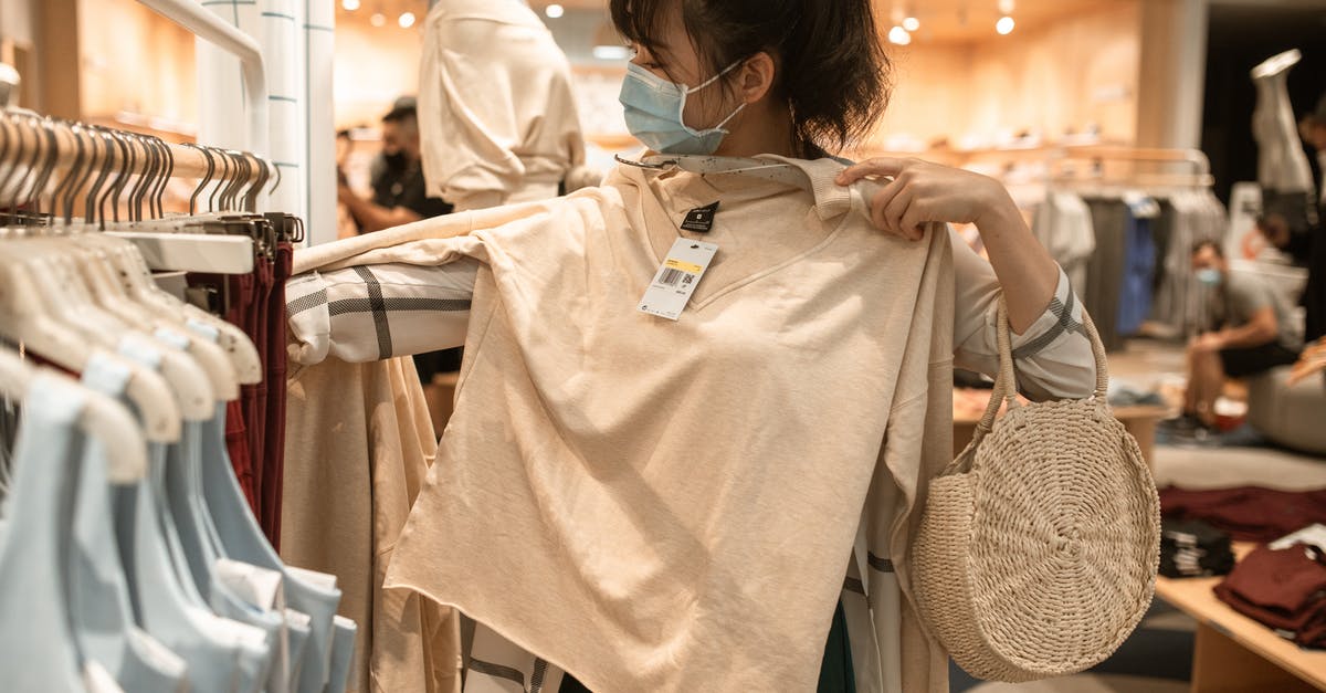 Measuring my options to reach the SF airport - Woman Measuring The Length of A Beige Long Sleeve Shirt