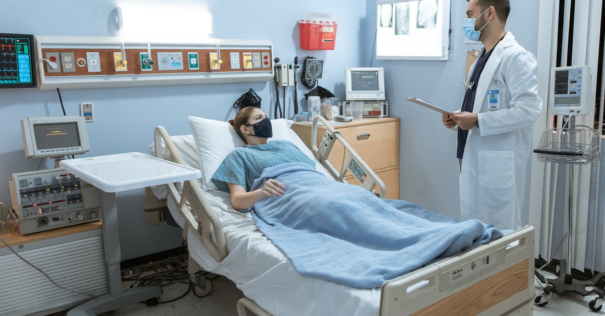 Medical attendant visa for Sweden - Doctor Talking to a Patient Lying Down on a Hospital Bed