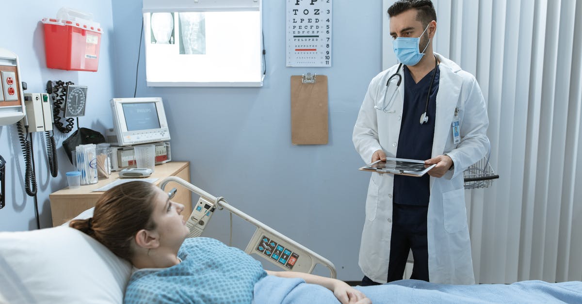 Medical attendant visa for Sweden - Doctor Talking to a Patient Lying Down on a Hospital Bed