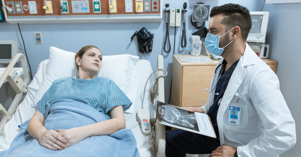 Medical attendant visa for Sweden - Doctor Talking to a Patient Lying Down on a Hospital Bed