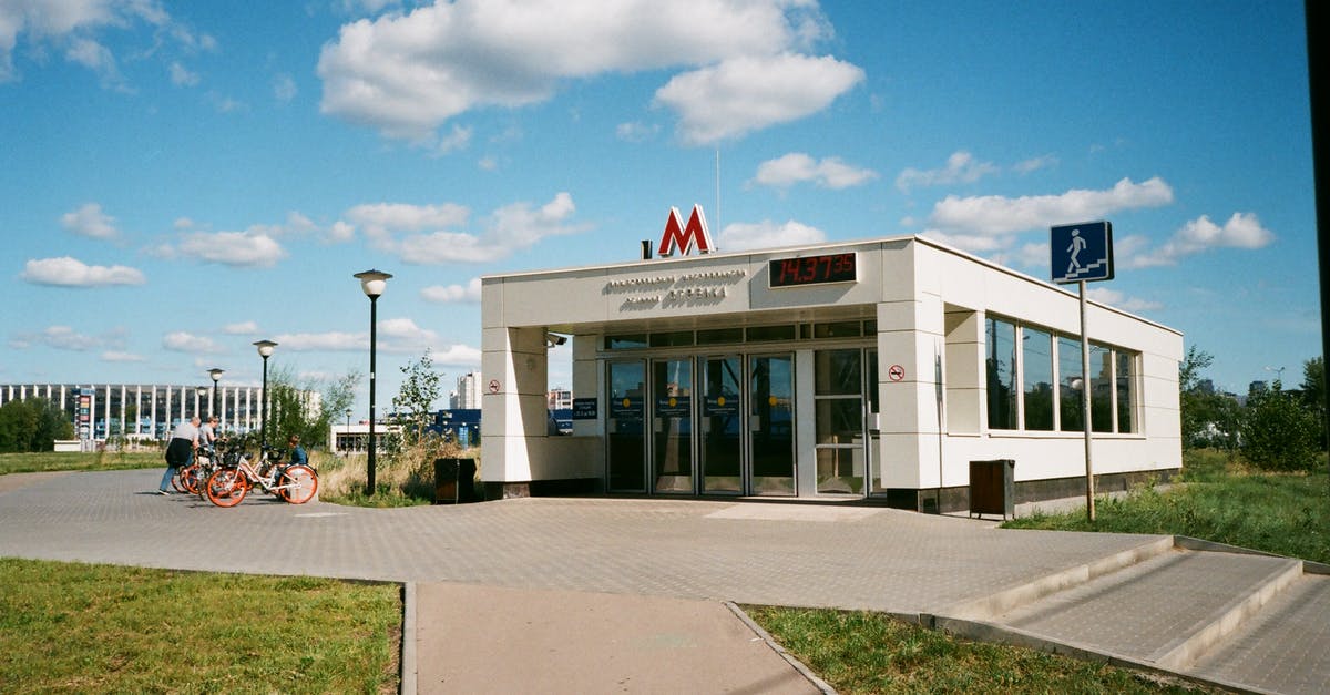 Metro areas with the biggest daytime bulge in population? [closed] - Exterior of modern metro station on city street near sidewalk with grass at daylight