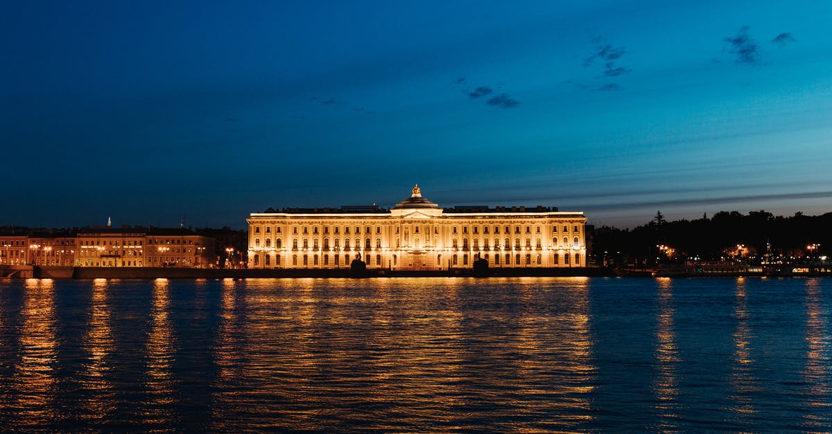 Migration registration when visiting Russia - White Concrete Building Near Body of Water during Night Time