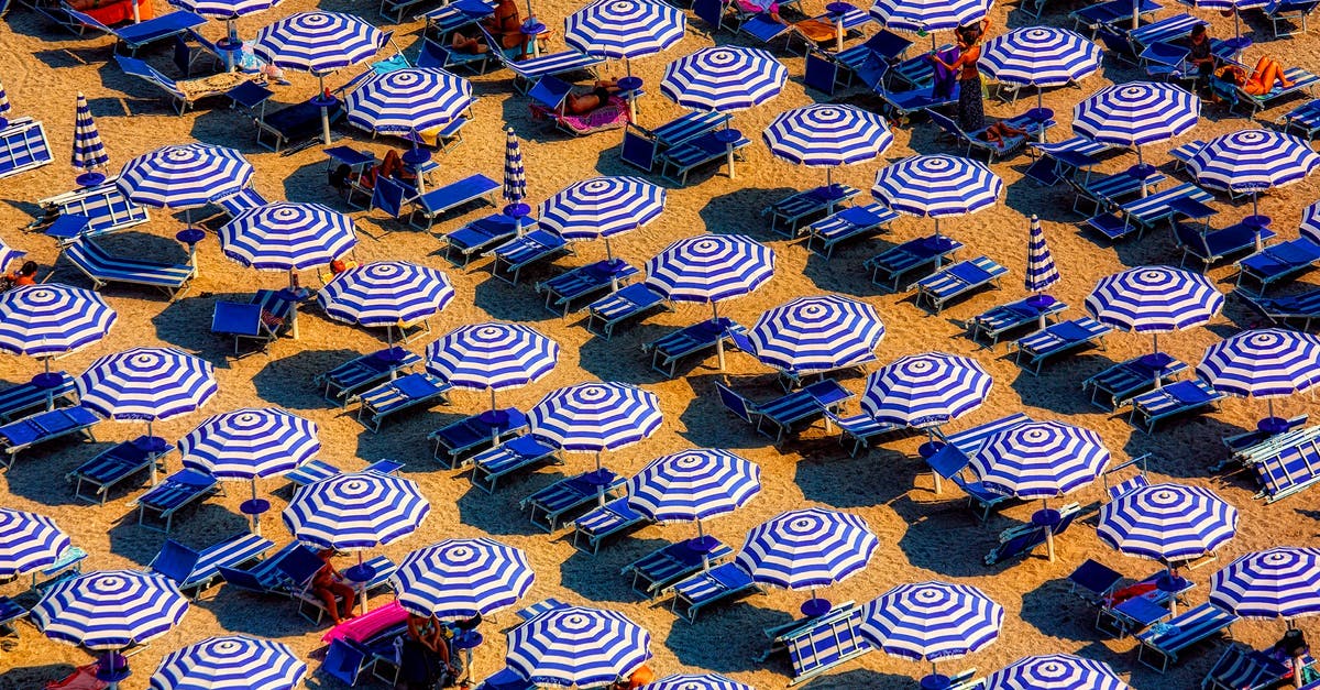 Milano style hot chocolate in Geneva-Bern-Zurich? - Aerial View of Blue and White Open Cottages at the Beach