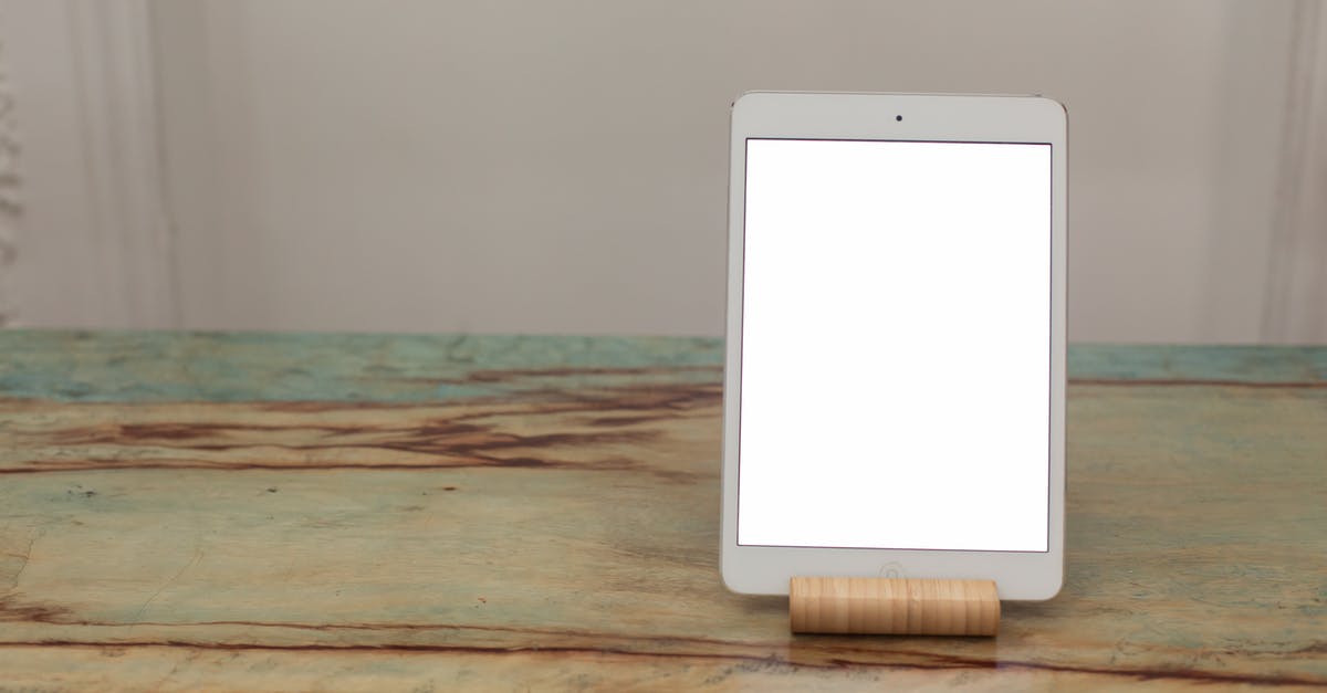 Minimum available passport blank page requirements - White Ipad on Brown Wooden Table