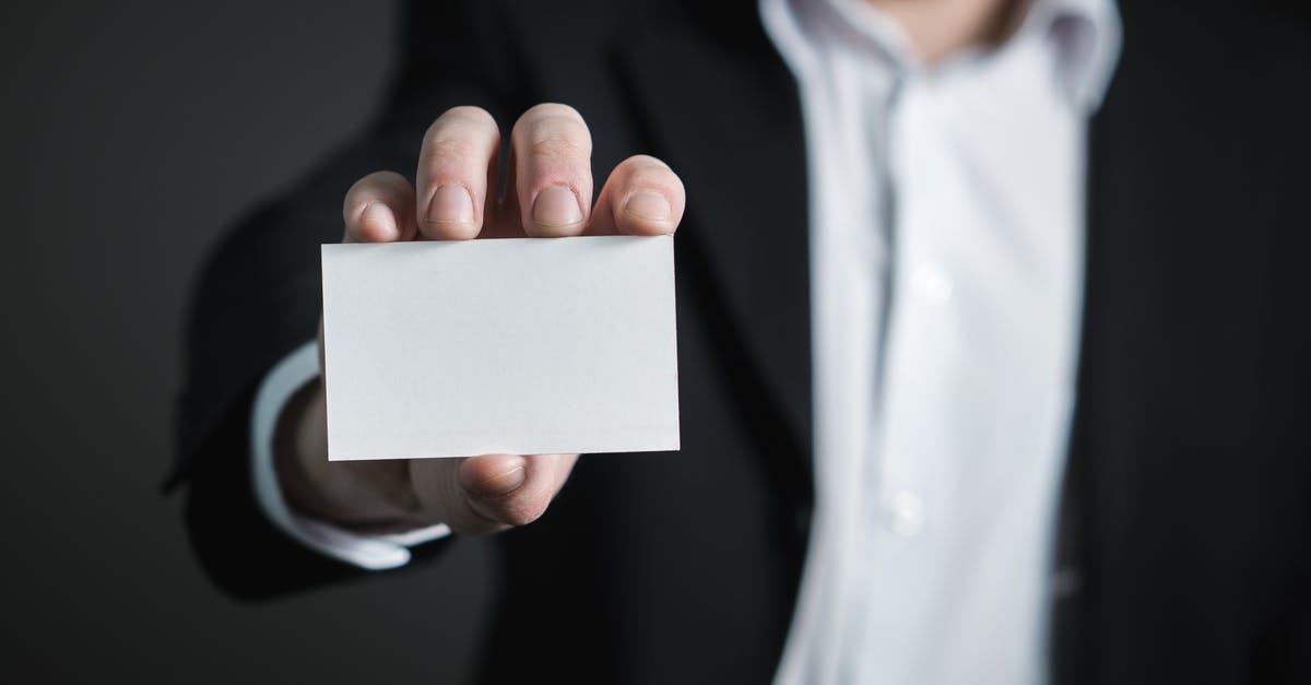 Mistake regarding national identity card - Close-up of Hand Holding Text over Black Background