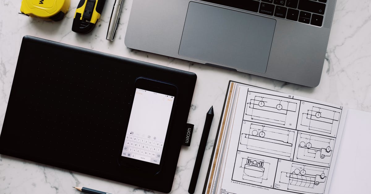 Mobile apps as alternative to paper boarding pass - Modern workplace with gadgets and opened notebook with pen and pencil on marble table at home