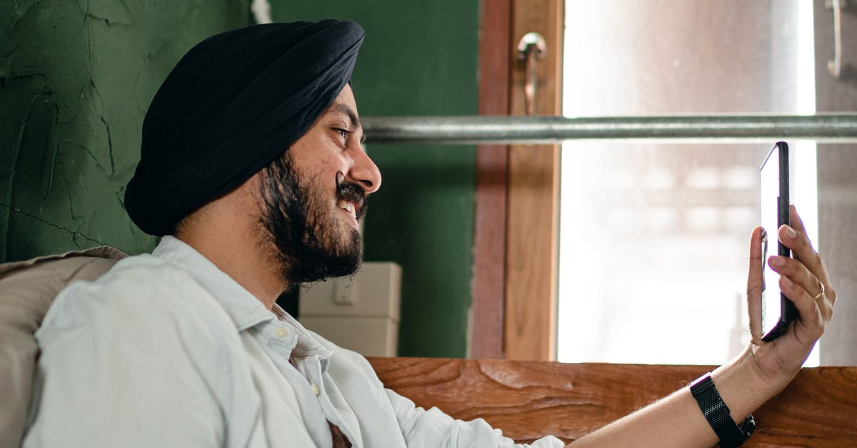 Mobile Internet Carriers in Eastern Europe [closed] - Young man in turban communicating via video call on mobile