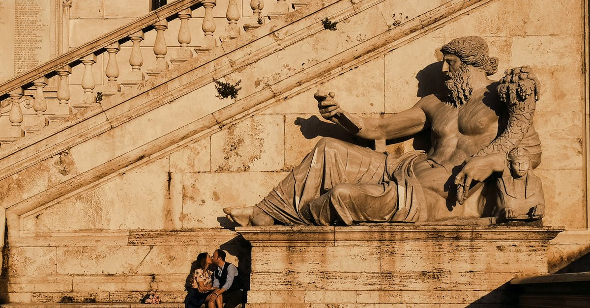 Motorboat rental in Lazio, Italy - Photo Of Couple Kissing Beside Statue