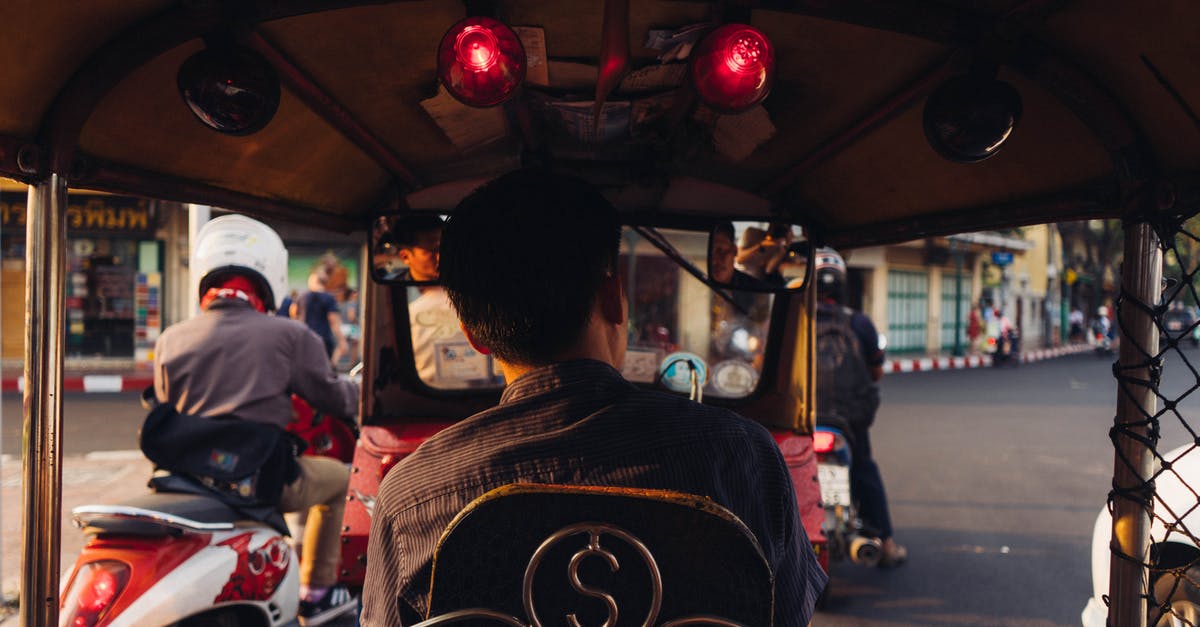 Motorcycle insurance in Southeast Asia - Man Sitting Inside Vehicle