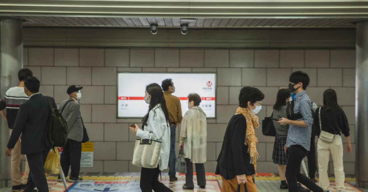 Moving and wonder if I need to stop at weigh stations? - Ethnic people walking in underground passage in masks