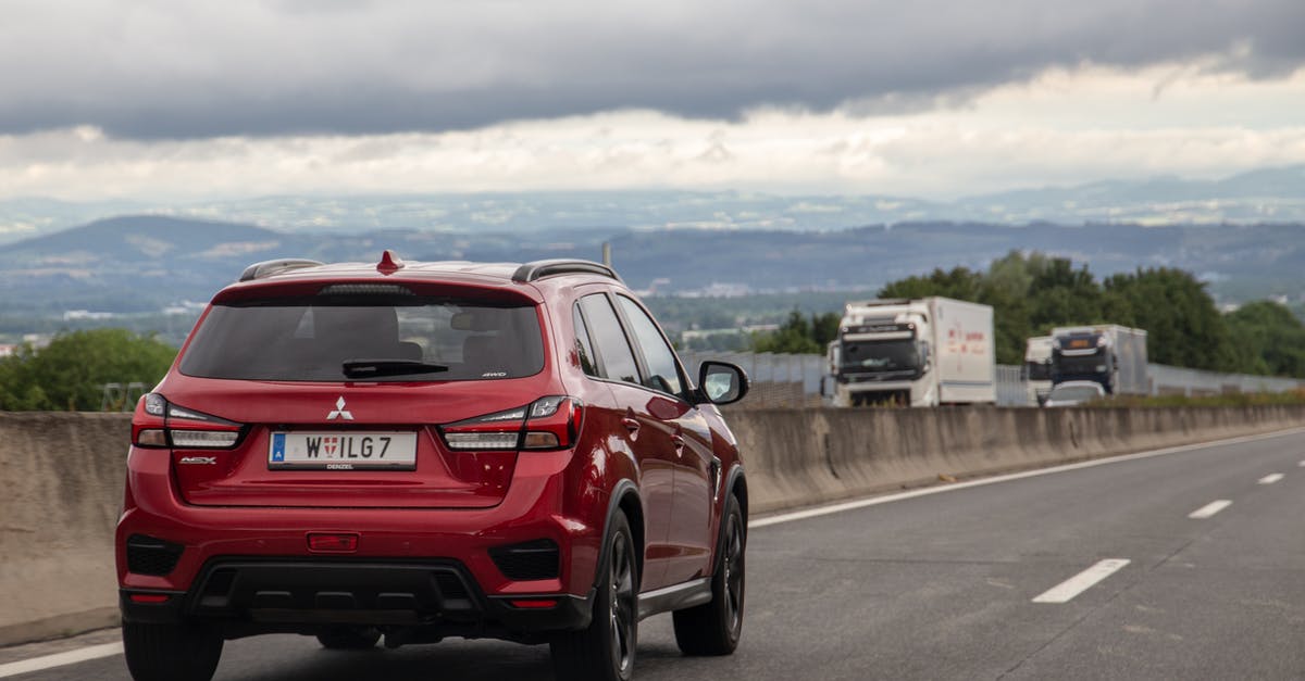 Moving to the Netherlands by car [closed] - Red Honda Car on Road