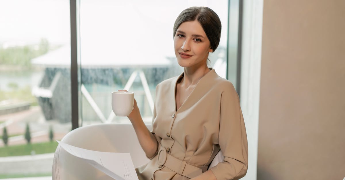 Mugging 'Etiquette'? - Woman in Brown Long Sleeve Shirt Sitting on Chair