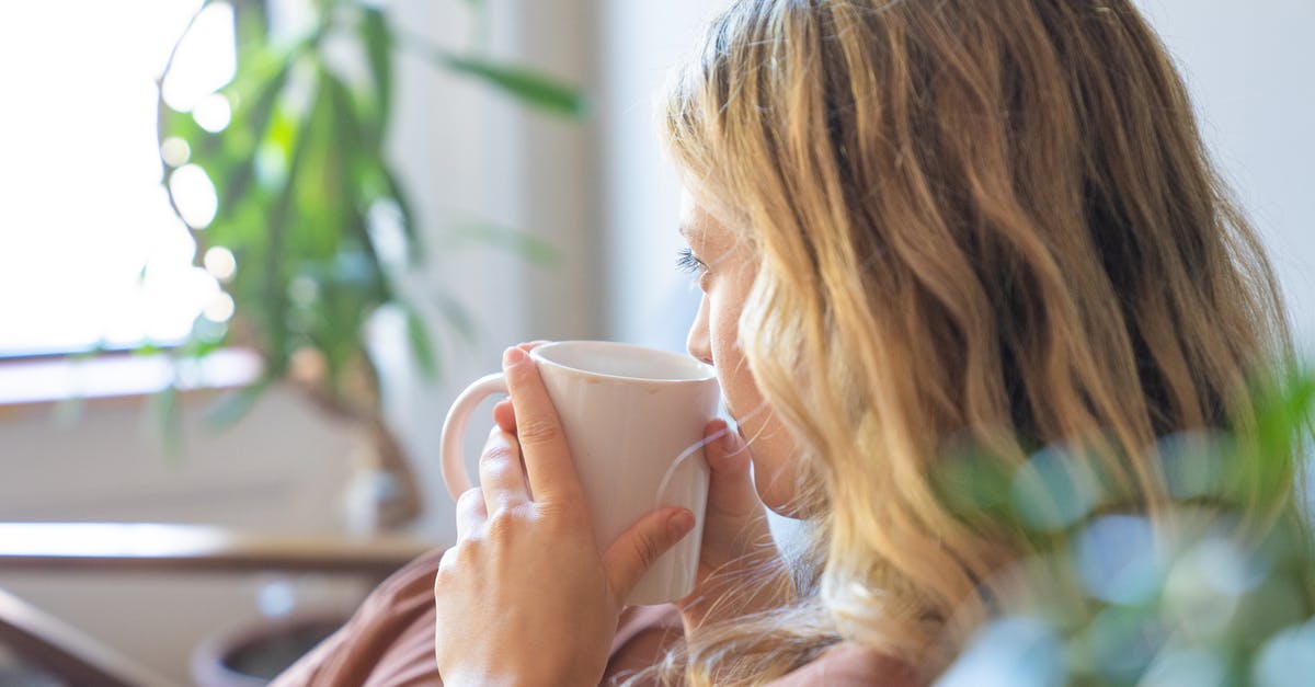 Mugging 'Etiquette'? - Woman in Pink Shirt Holding White Ceramic Mug