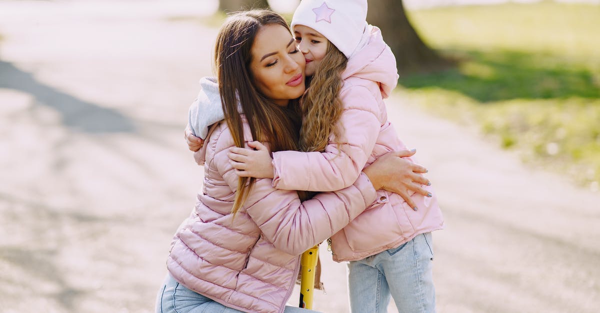 Multiple Schengen visa at the same time - Girl kissing and hugging mom in park