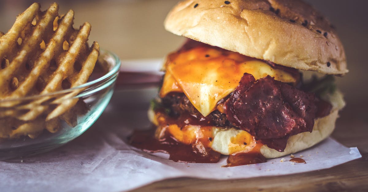 Mushroom grilled sandwich in Budapest - Closeup Photography of Bun With Cheese, Patty, Egg, and Bacon