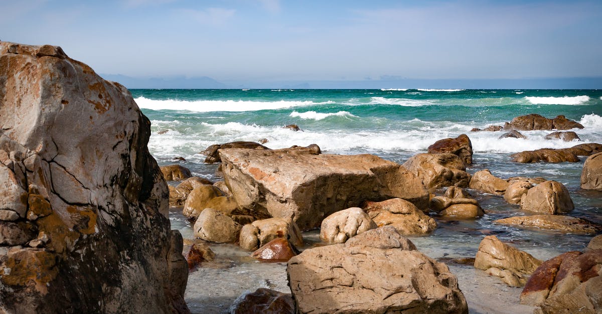 Must I provide proof of onward travel when entering South Africa? - Seashore With Rocks Under Blue Sky