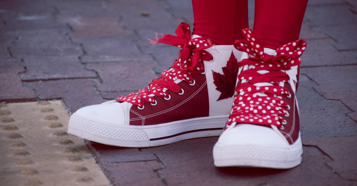 my vwp not authorized, does it affect get to canada [closed] - Closeup Photo of Person Wearing White-and-red Maple Leaf-printed Lace-up Sneakers