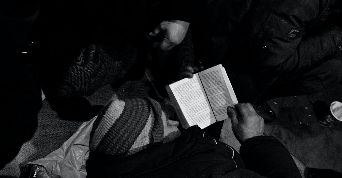 Need help identifying a flag from La Jolla, California - Black and white of homeless man lying on floor and reading book in night shelter for homeless