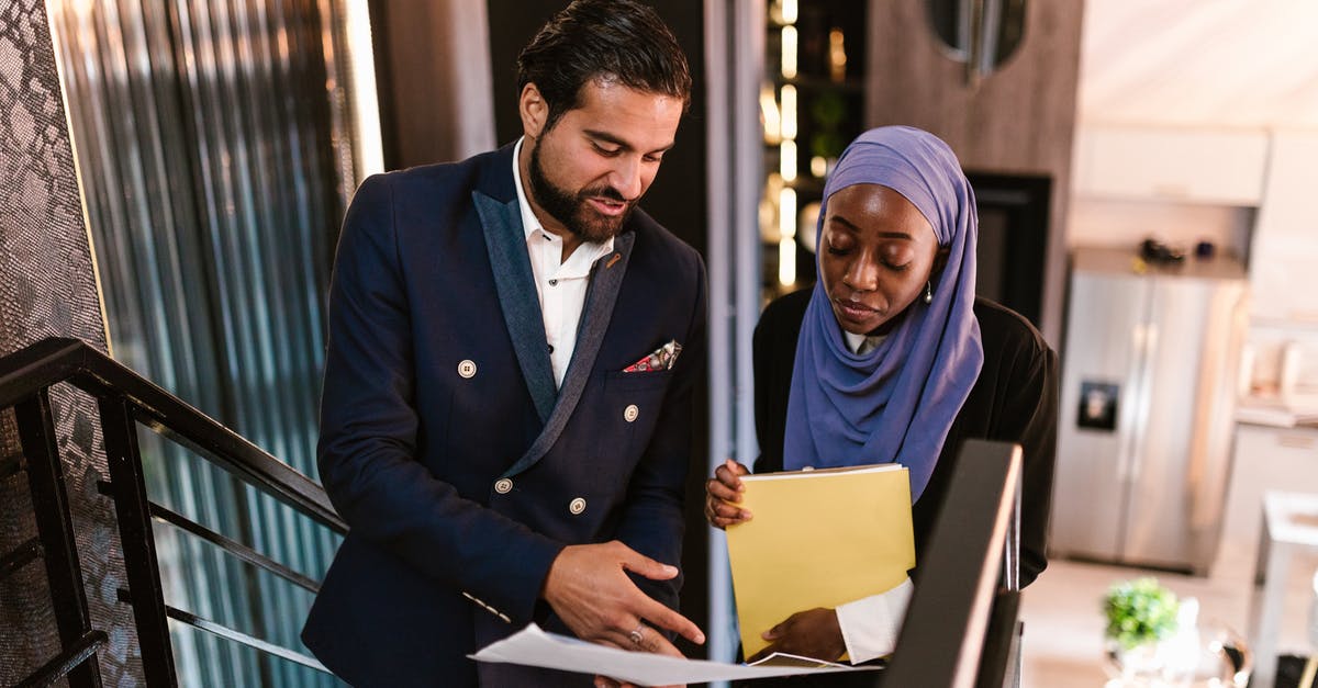 Negotiating cultures: tips on bargaining [duplicate] - A Man and Woman Having Conversation while Walking Up on Stairs