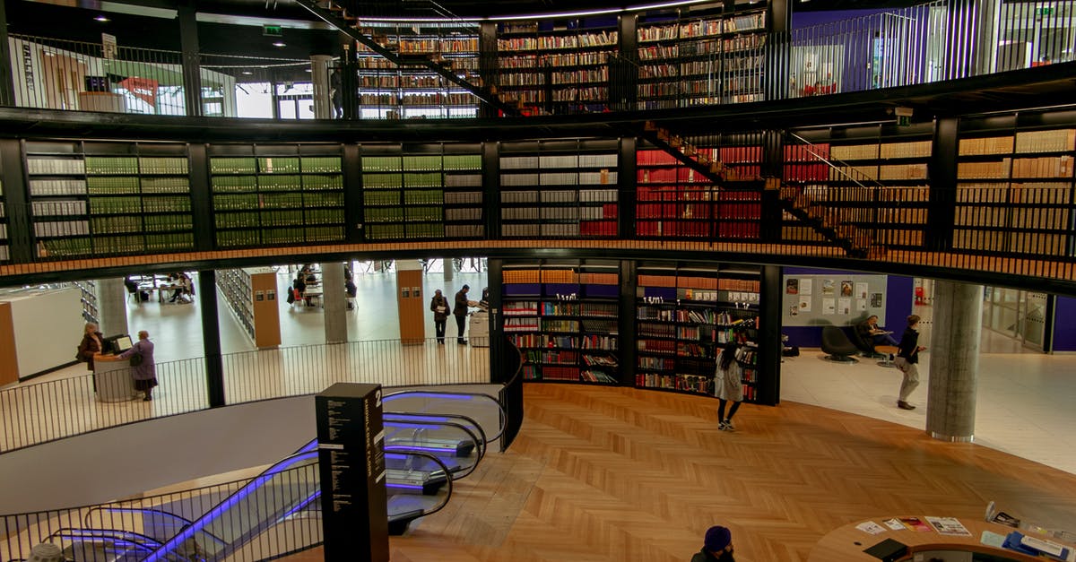 New application for UK visitor visa after previous refusal - People in modern library with books