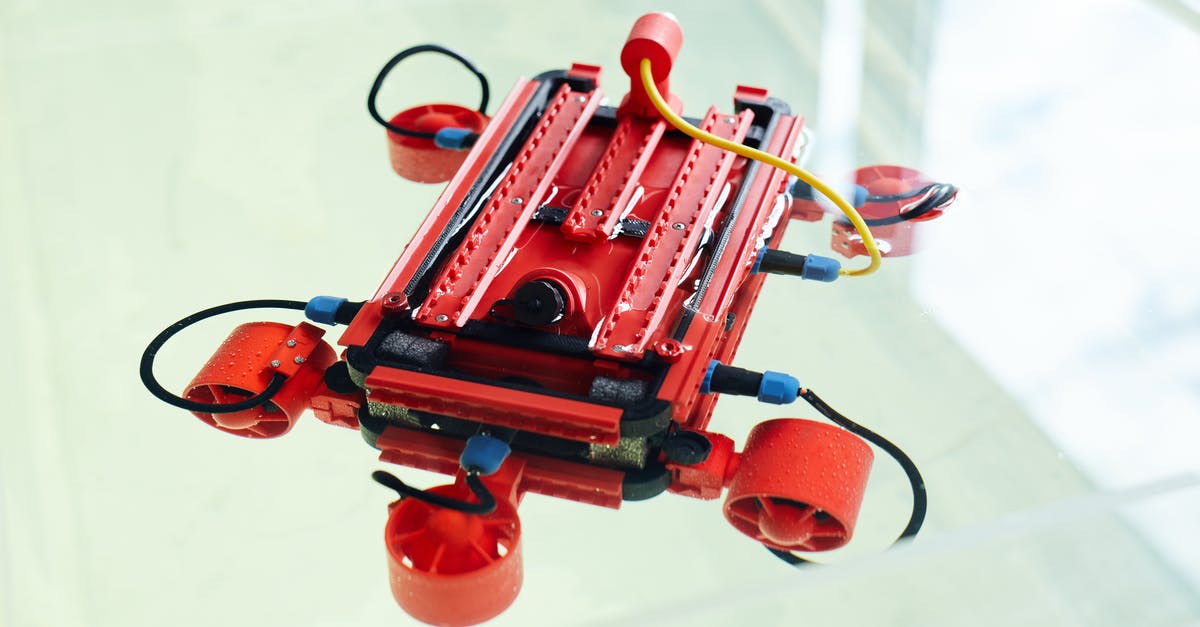 New device checking rules for flights to/from USA - Robot made with 3d printer with cables and wires against white background