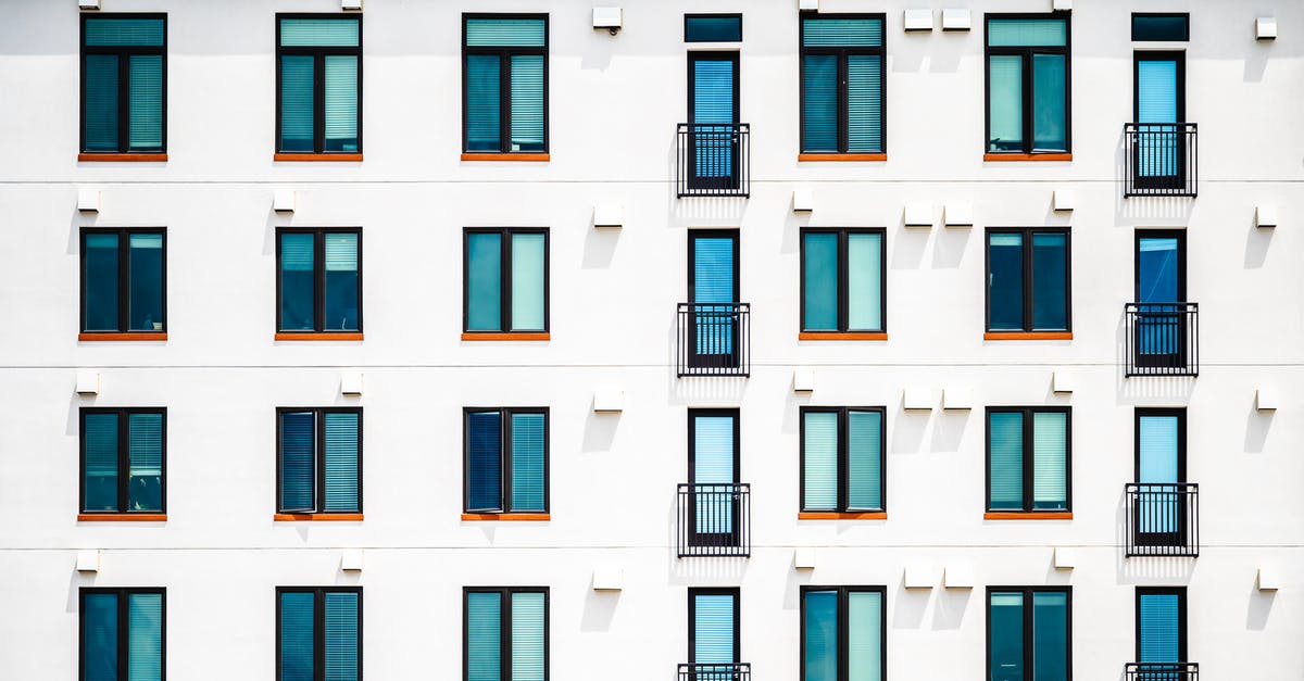 New Jersey area Christmas Town [closed] - Facade of new white apartment building of simple minimalist style on clear day