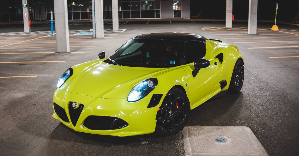 New Jersey area Christmas Town [closed] - Bright yellow modern sports car with LED headlights parked on asphalt road on parking area