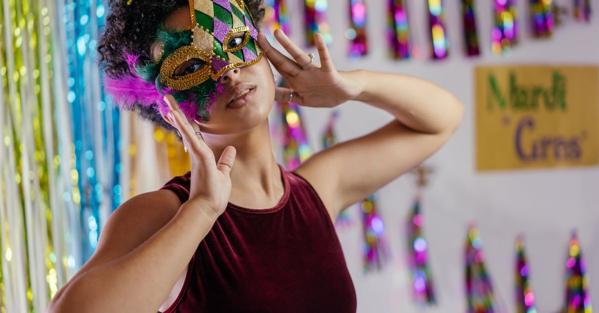 New Orleans Mardi Gras and beads - 
Woman Wearing Mardi Gras Mask on Her Face


