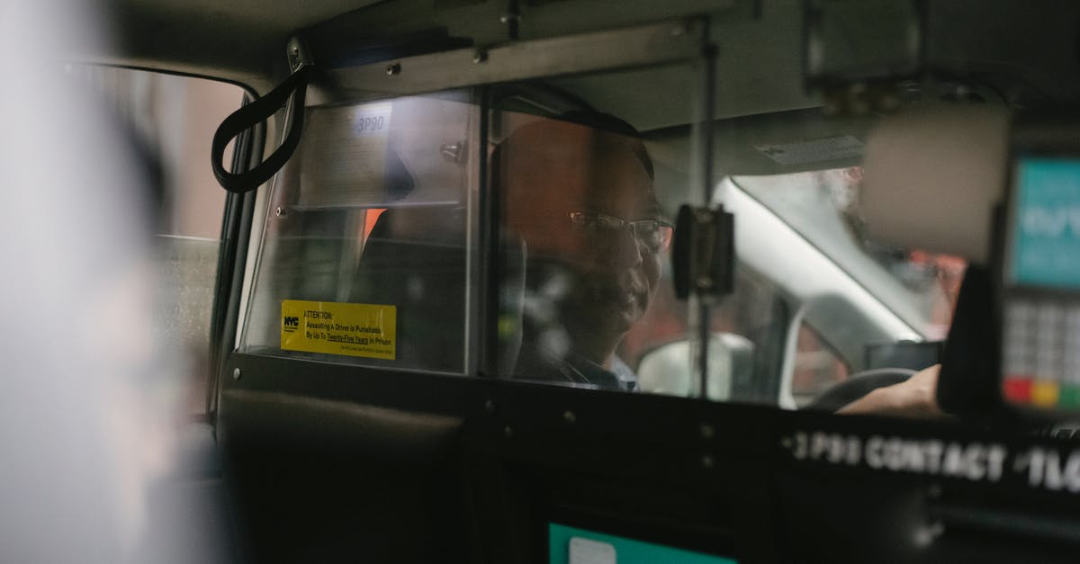 Newark transit from terminal B to terminal A on separate itineraries - Ethnic driver in taxi with partition