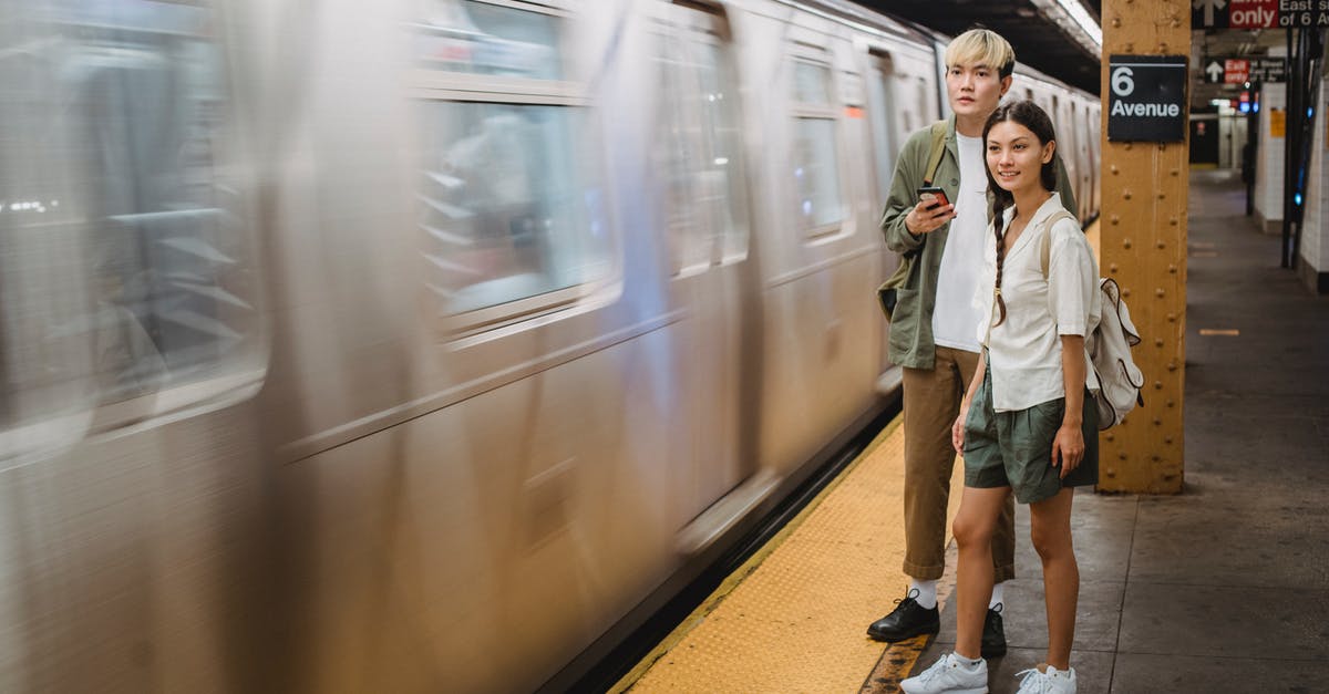 NJ Transit Train first time riding - Young trendy ethnic passengers waiting for train on platform