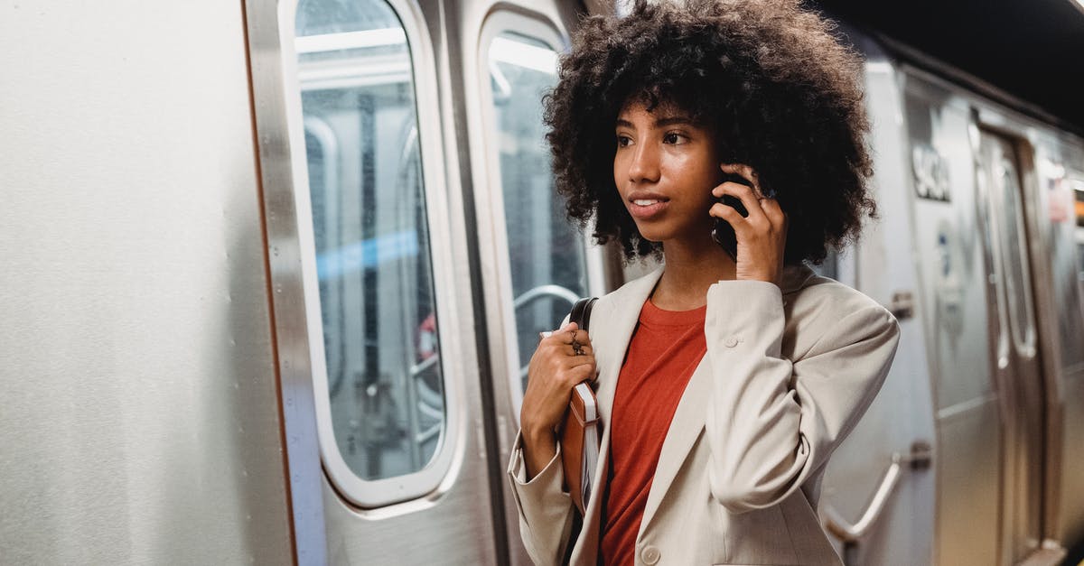 No train reservation - Woman in White Coat Holding Her Face