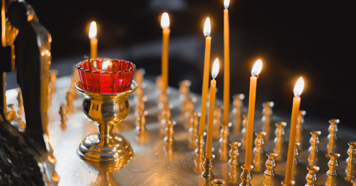 Northern Lights in Alaska [closed] - Lighted Candles on Gold Candle Holder