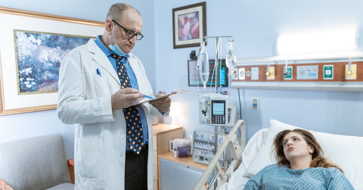 Not having a job when asking for a Schengen visa - A Physician in White Coat Checking Up on His Patient