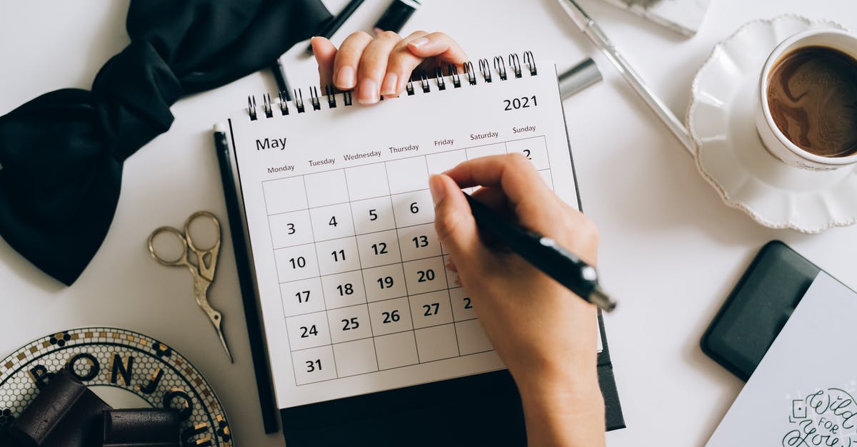 Number of days stay in Schengen countries - A Person Writing on a Desk  Calendar