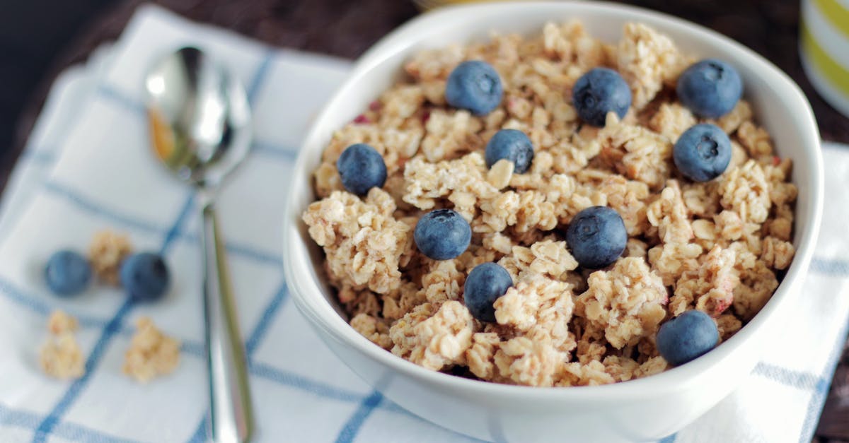 Oat Bran in Sealed Canisters - Bowl of Cooked Foods Beside Spoon