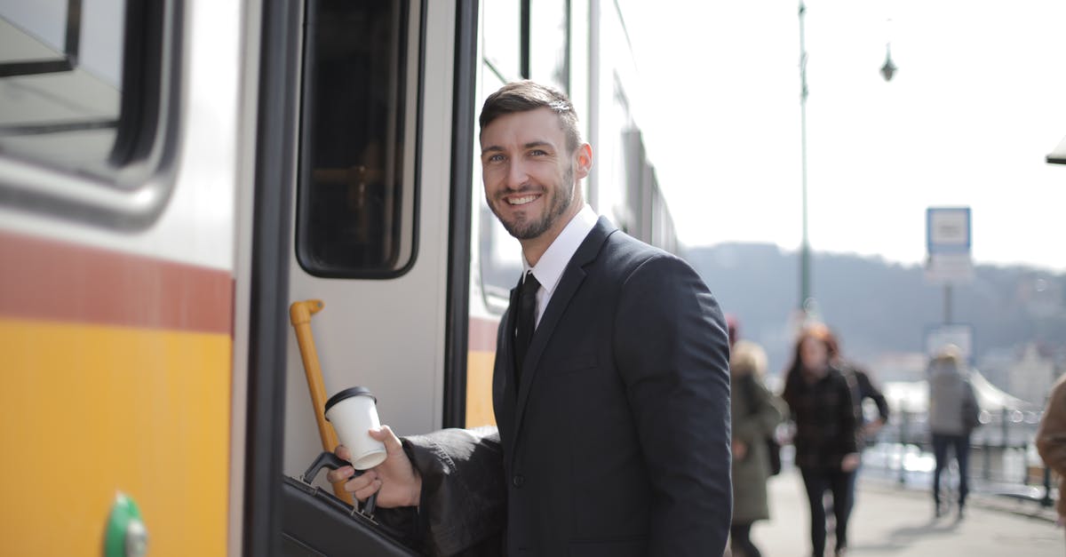 Offline public transportation trip planning for Rome - Man in Black Suit Jacket Holding Black Leather Bag