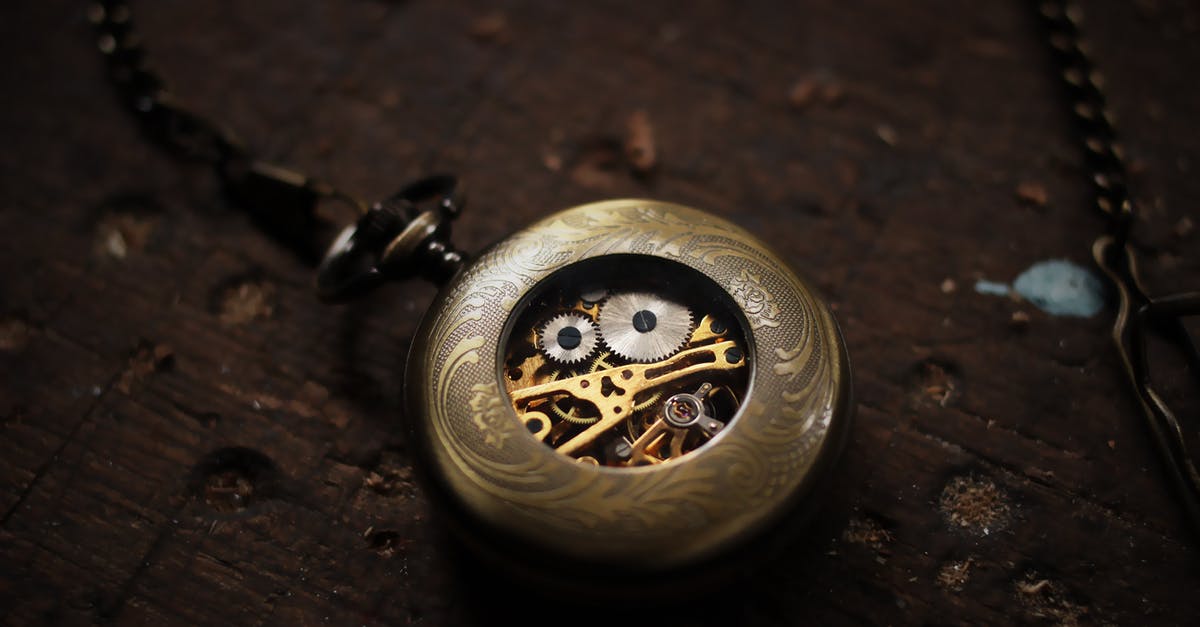 Old Marriott Gold perks after SPG/Marriott account merger - Silver-colored Pocket Watch on Brown Wooden Surface