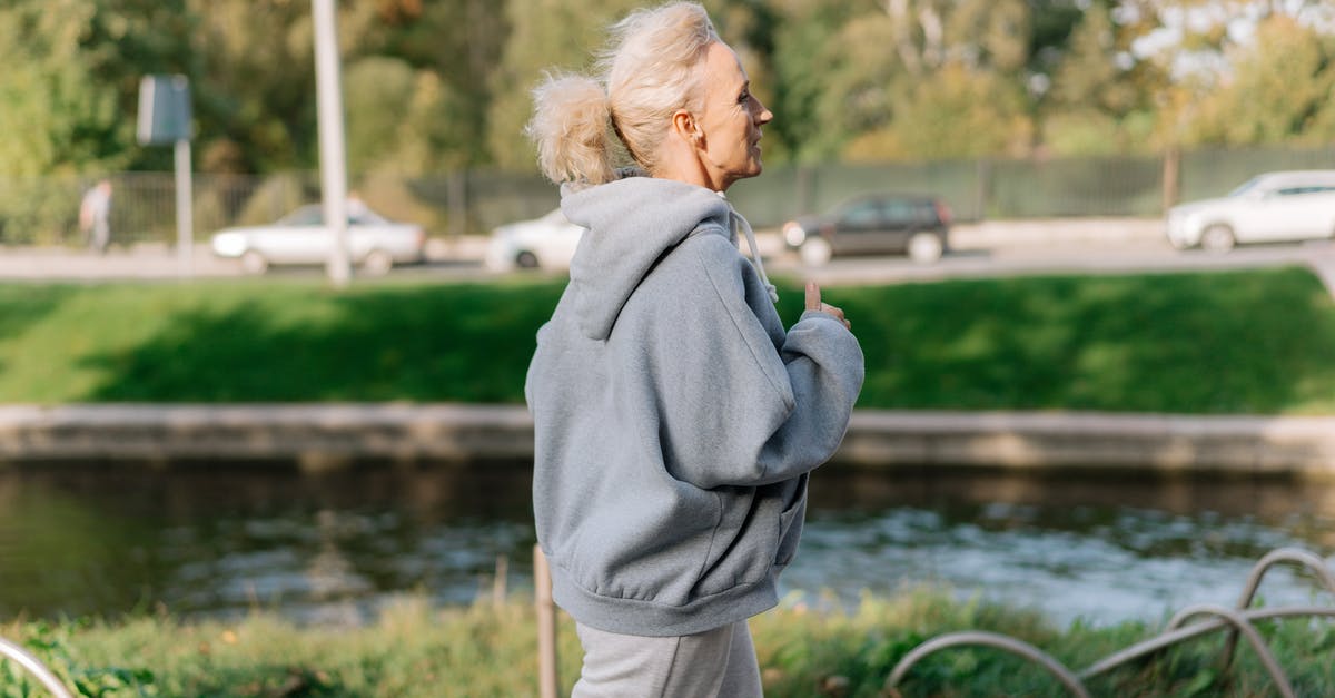 Old passport with Active Visa - Woman in Gray Hoodie Sweater Jogging