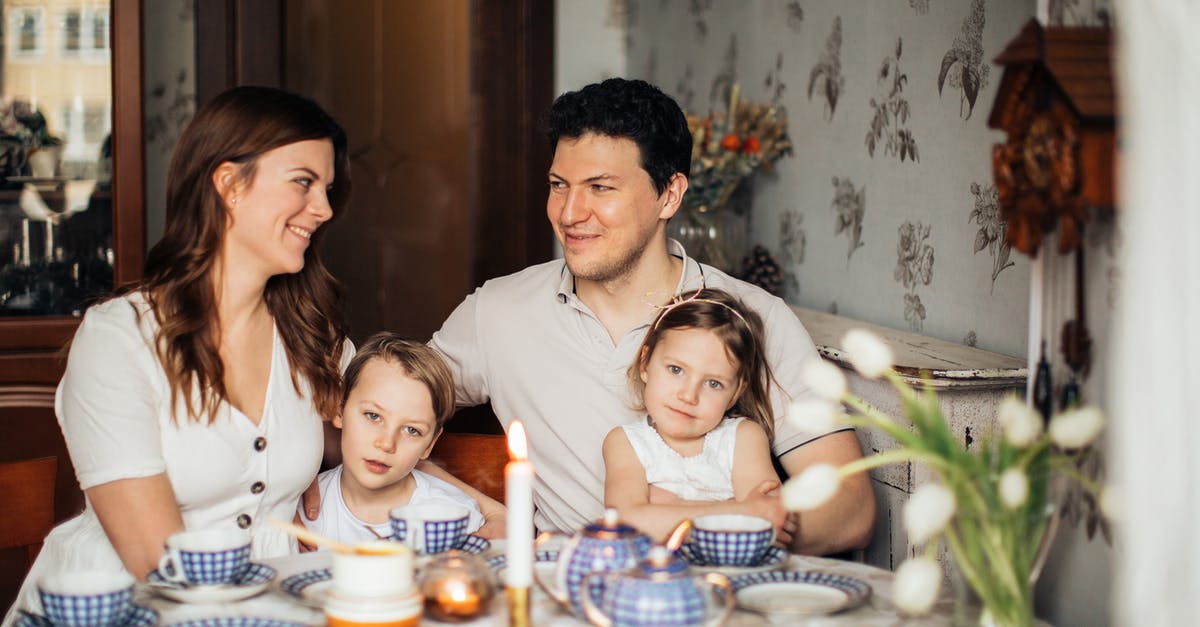 Oman Visa for Russian Women - Family Sitting at Table