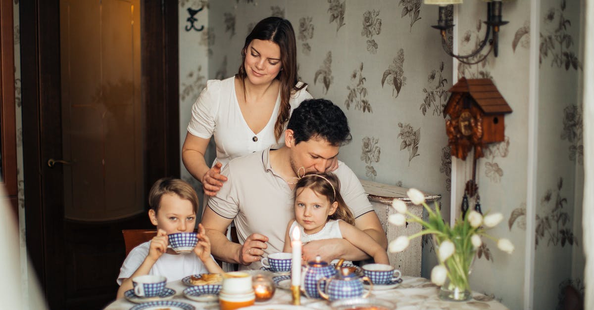 Oman Visa for Russian Women - Family Sitting at Table