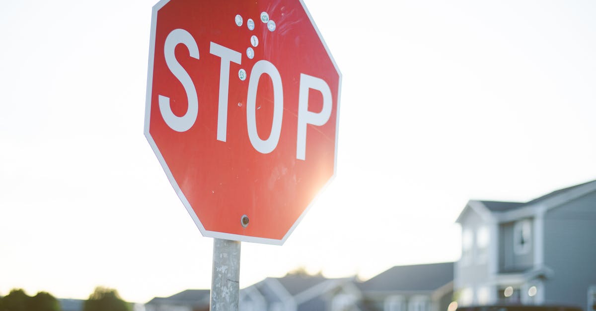 On a road that comes to a stop sign, and then veers slightly to the right, do you need to use a turn signal to stay to the right? [closed] - Red Stop Road Sign