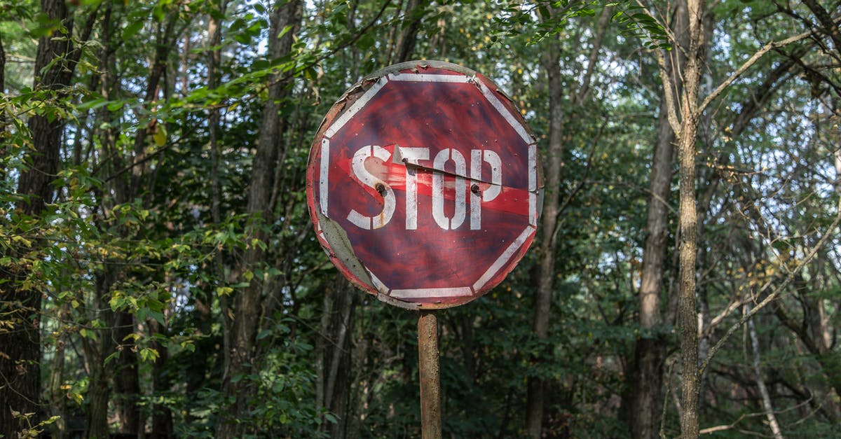 On a road that comes to a stop sign, and then veers slightly to the right, do you need to use a turn signal to stay to the right? [closed] - Red and White Stop Road Signage